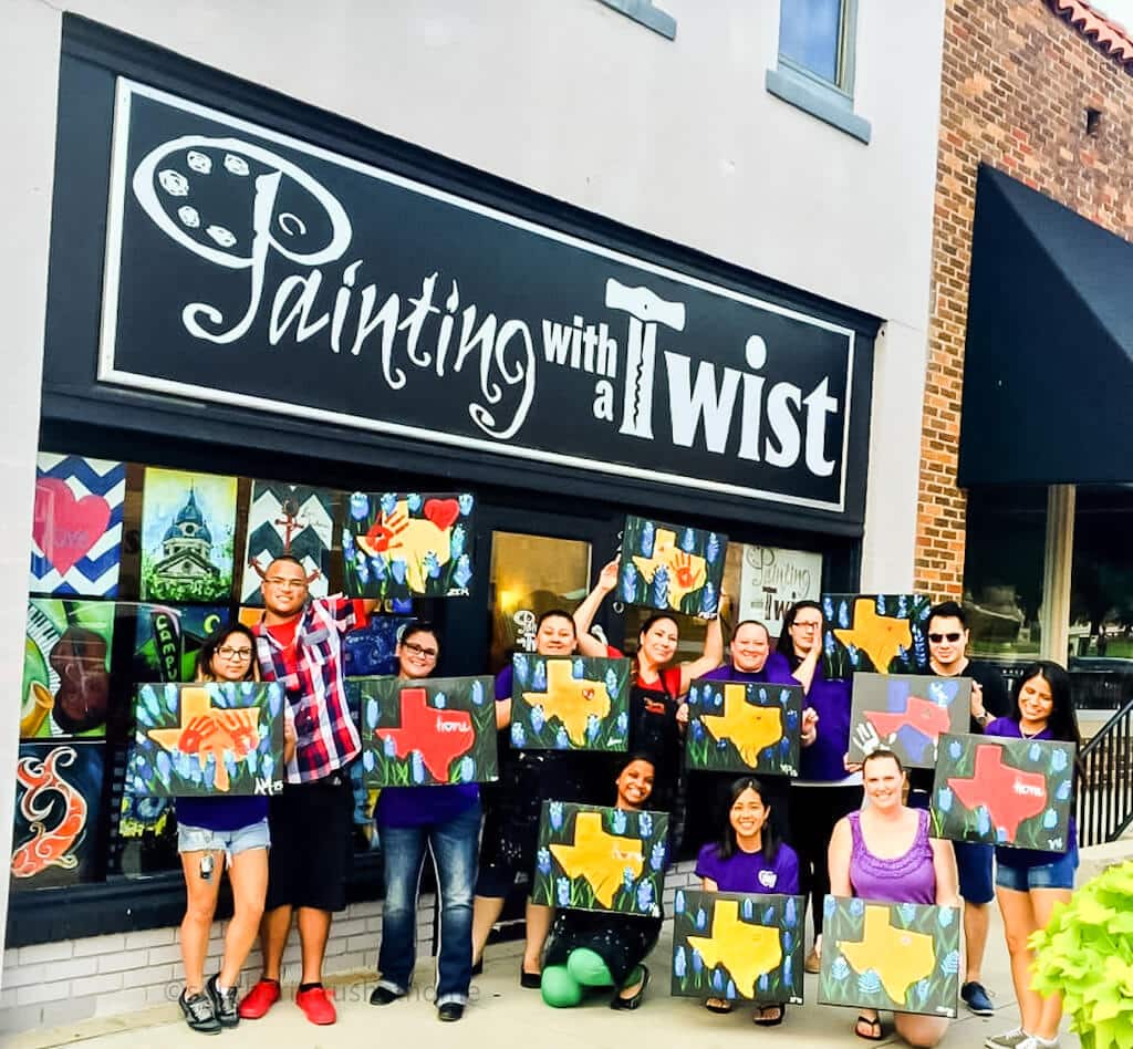 painting parties group in front of Painting with a Twist Denton location