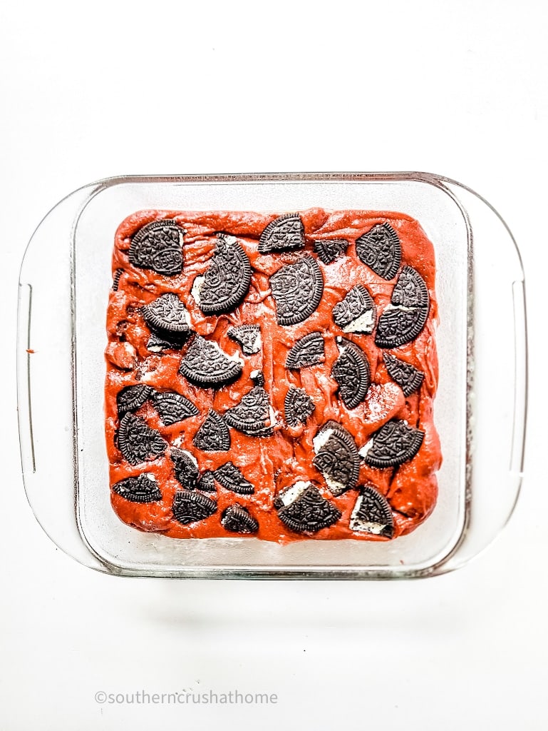 oreos on top of brownie batter in pan