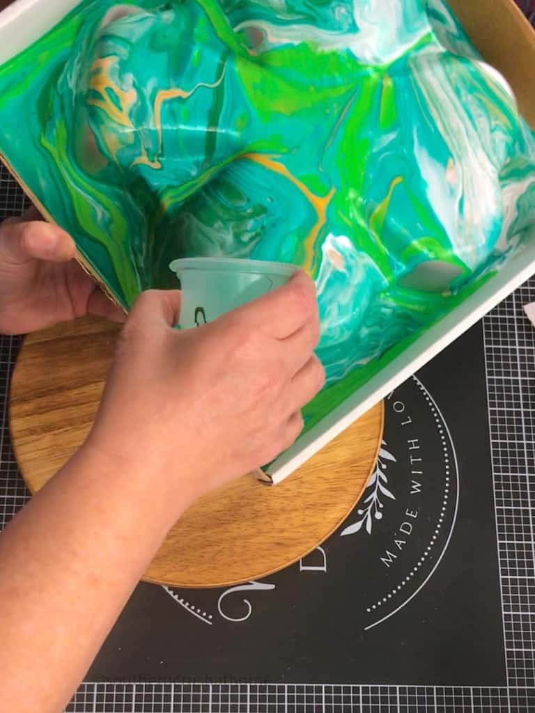 pouring Acrylic Pour Paints onto surface