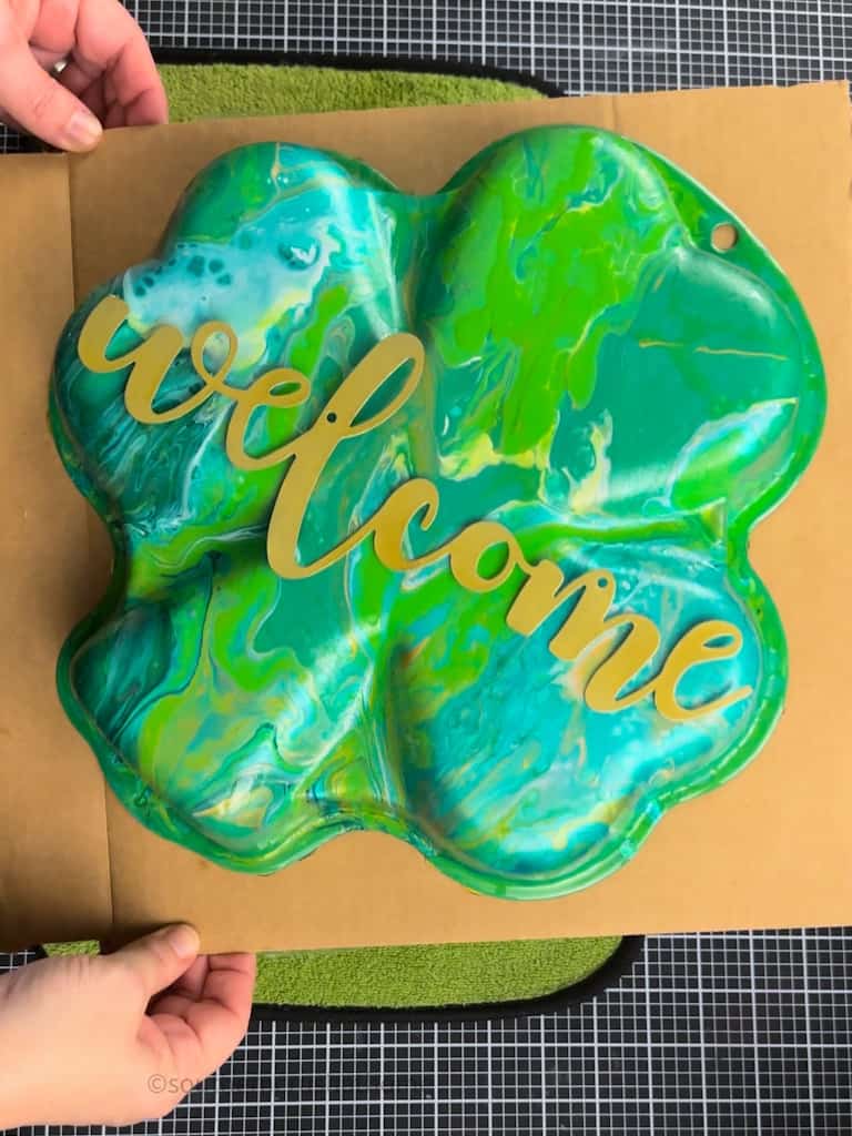 gold welcome sign on Acrylic Pour Painting