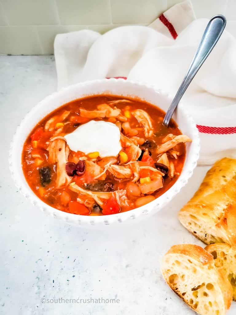 overhead view of Chicken Taco Soup in a bowl with spoon