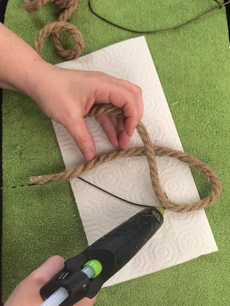 hot gluing nautical rope to coat hanger