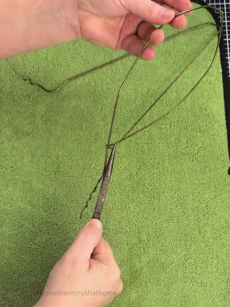 bending over coat hanger with pliers