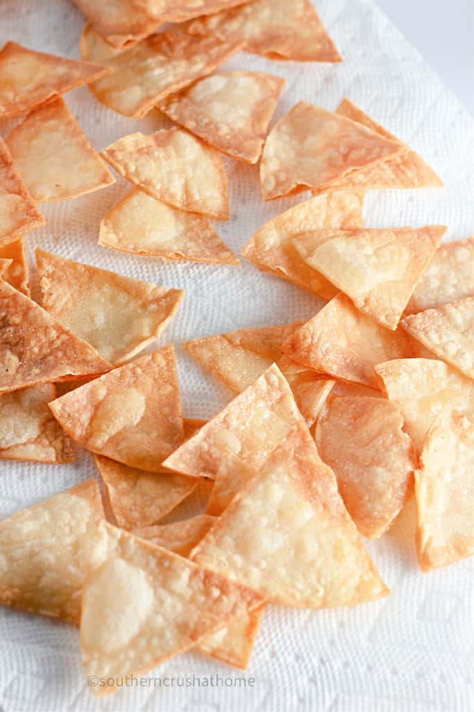 homemade corn tortilla chips laying out to drain grease