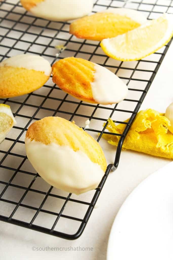 dipped Madeleine Cookies on wire cooling rack