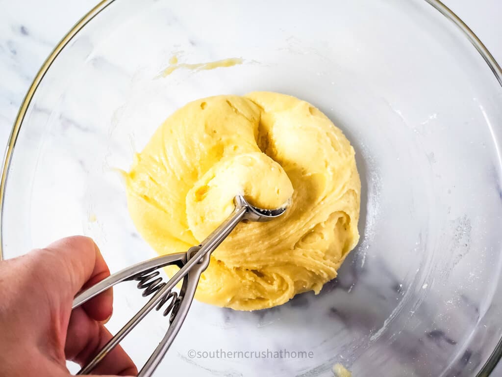 scooping yellow cake mix cookie batter