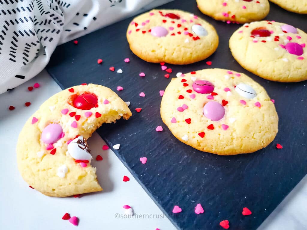 yellow cake mix cookies on black slate platter