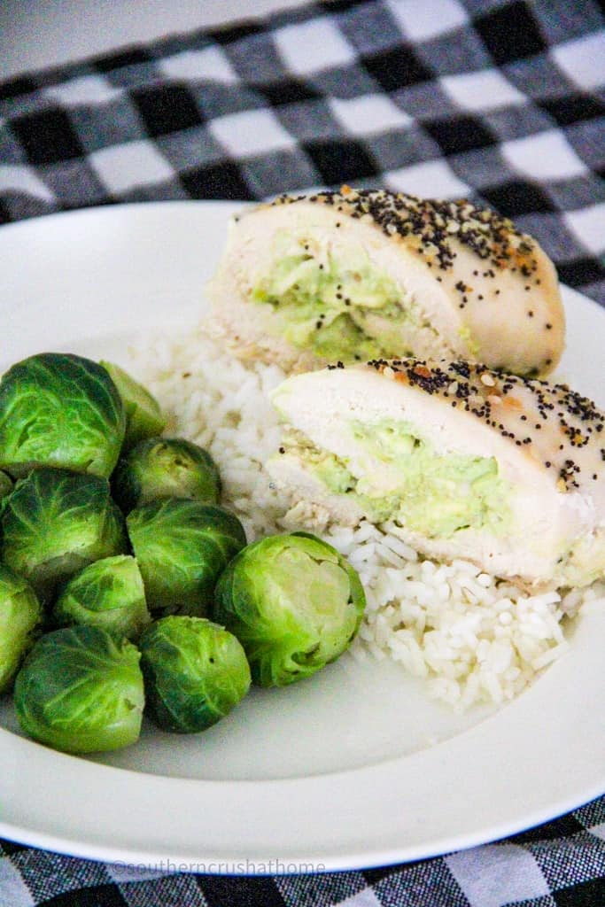 avocado chicken on plate with brussel sprouts