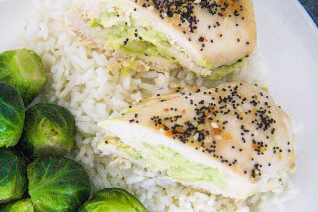 baked avocado chicken cut in half