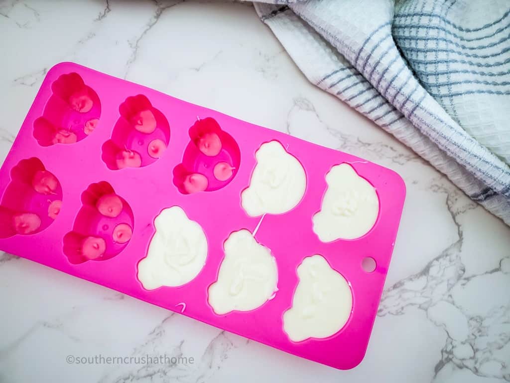 adding white chocolate to bunny butt molds