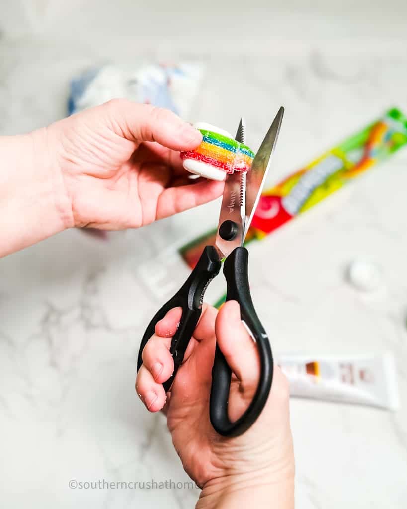 kitchen shears cutting rainbow candy