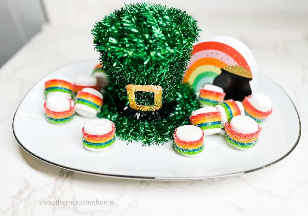 rainbow marshmallow treats on a platter with leprechaun hat