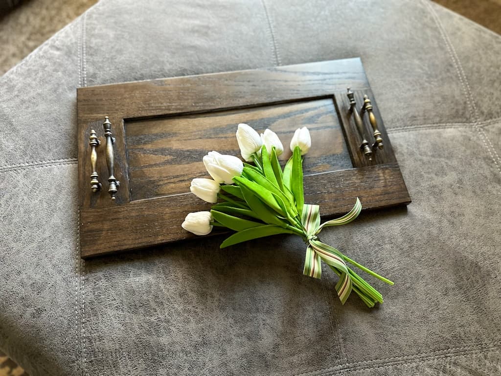 ottoman tray view from overhead with faux white tulips