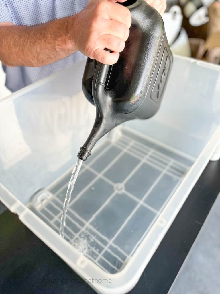 adding water to container for hydro dipping