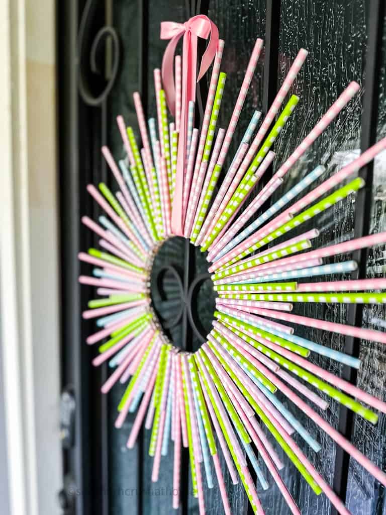 Spring Wreath using Paper Straws hanging on front door