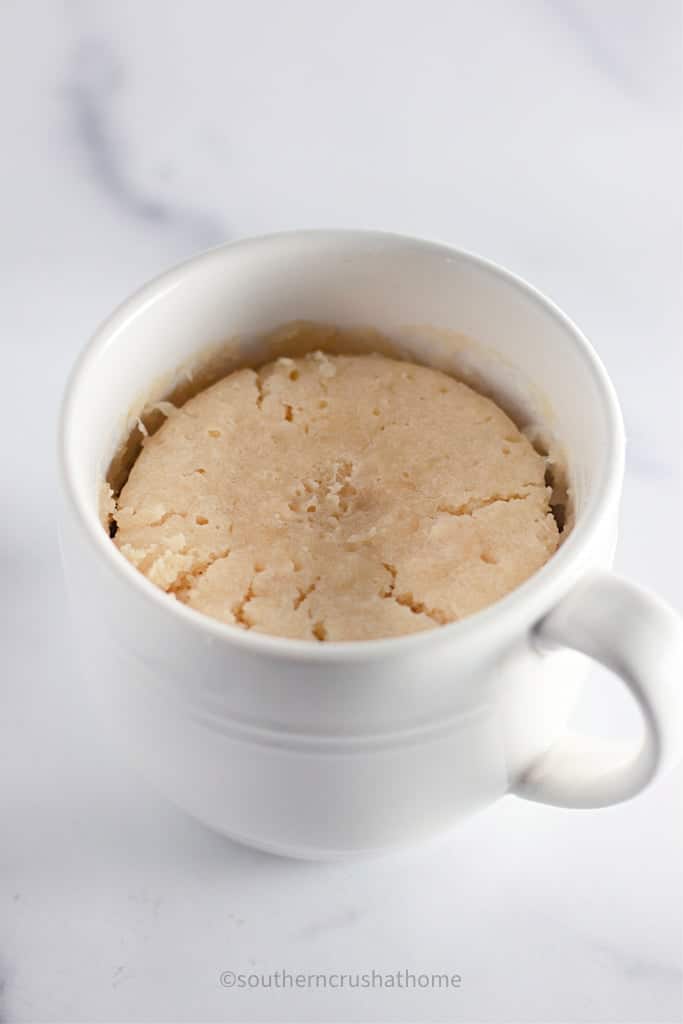 microwaved cooked vanilla mug cake in mug