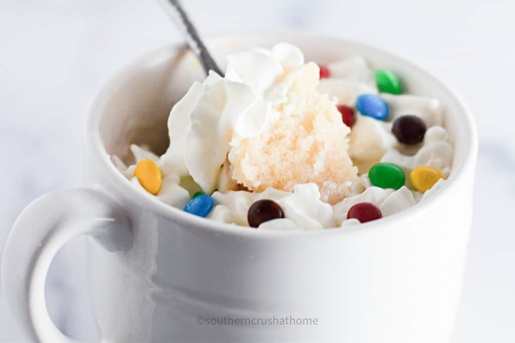 close up of bite of mug cake on spoon