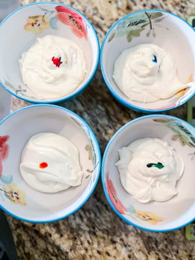 adding food coloring to frosting