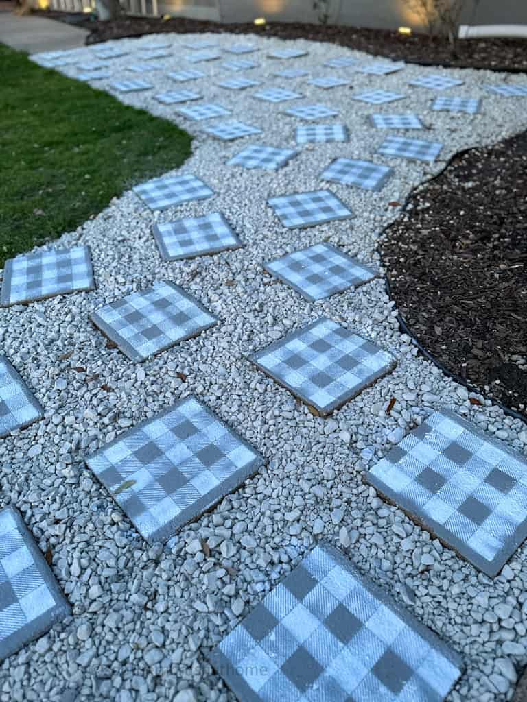 nightitme view of walkway pavers with solar lights