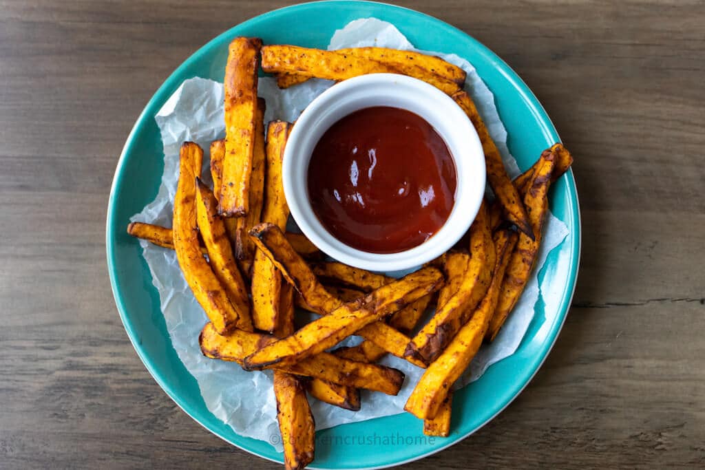 air fryer sweet potato fries on a blue platter