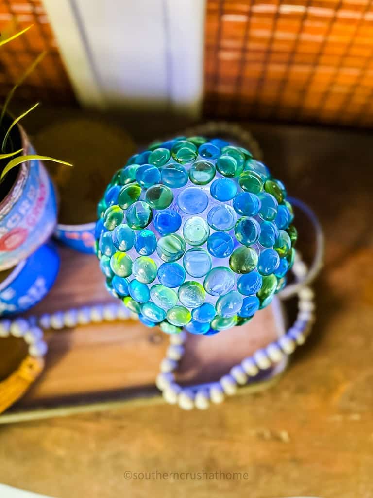 top of glass bowl with colored gems