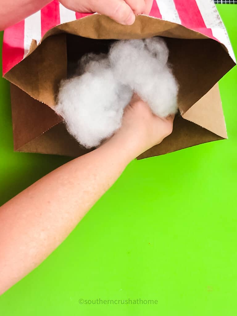 stuffing polyfill into paper bag