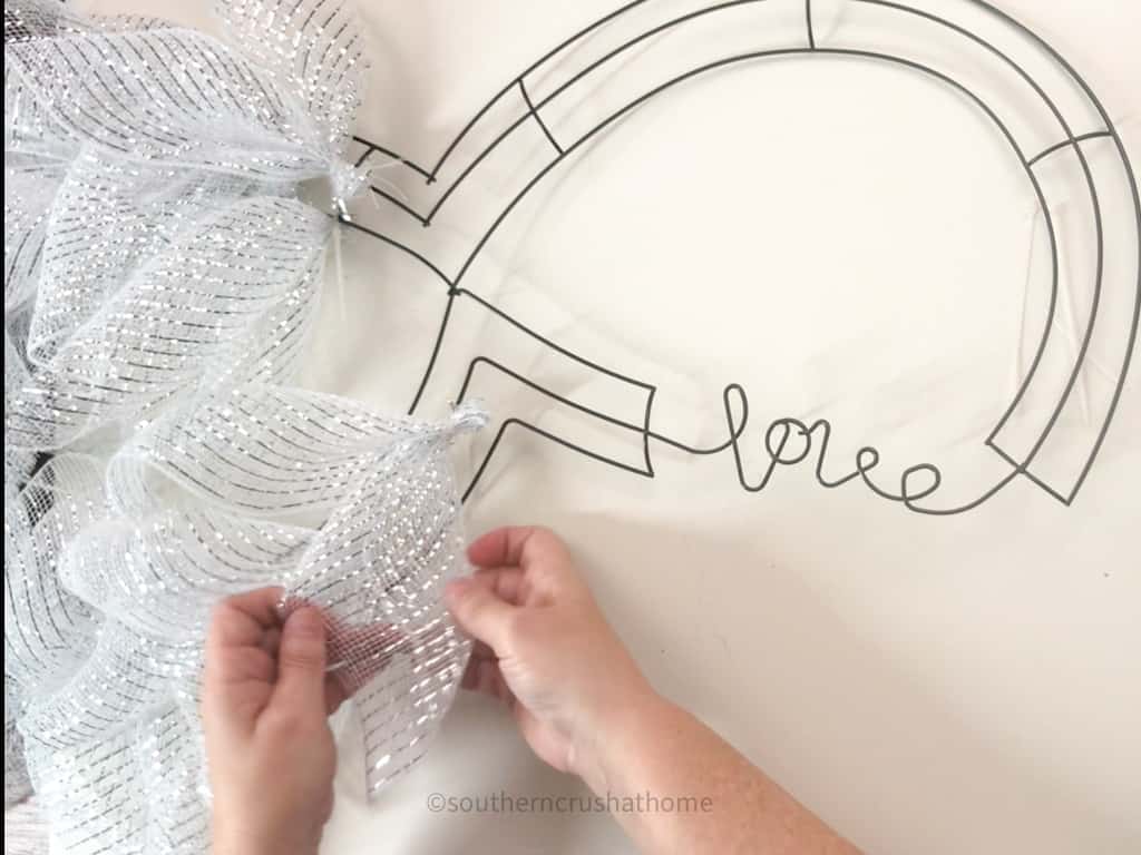 fluffing deco mesh on 
wreath frame