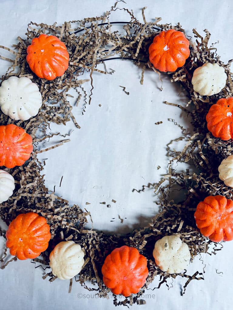 pumpkins arranged in wreath form