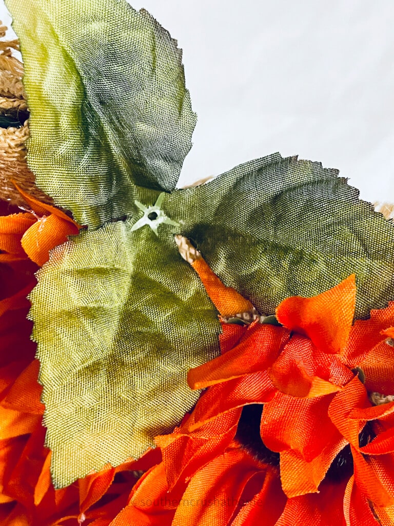 glue a leaf to the stem of the pumpkin