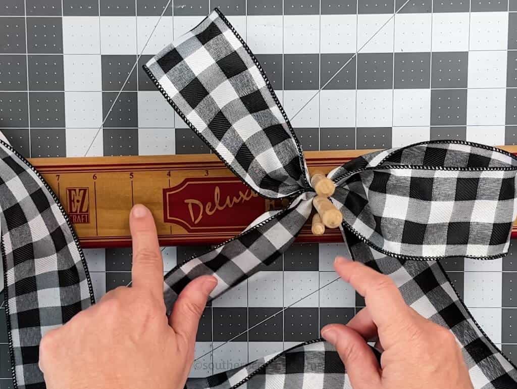 measuring a loop for a second set of loops on a double loop bow
