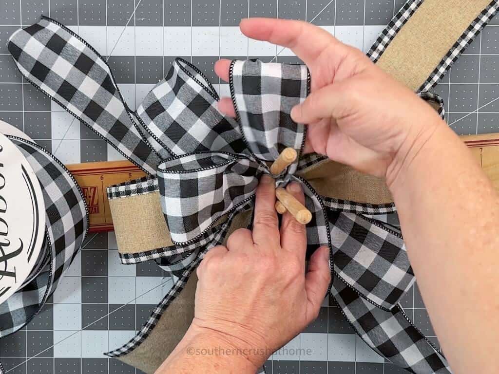 fluffing the loops on a multi-layer bow for how to make a bow tutorial