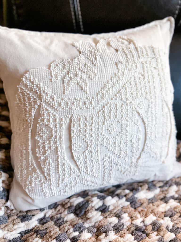 close angle view of fall pumpkin pillow diy vintage chenille bedspread