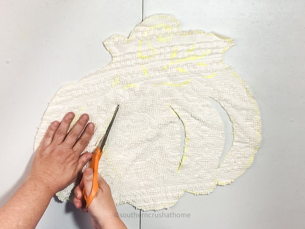 cutting out pumpkin from chenille bedspread