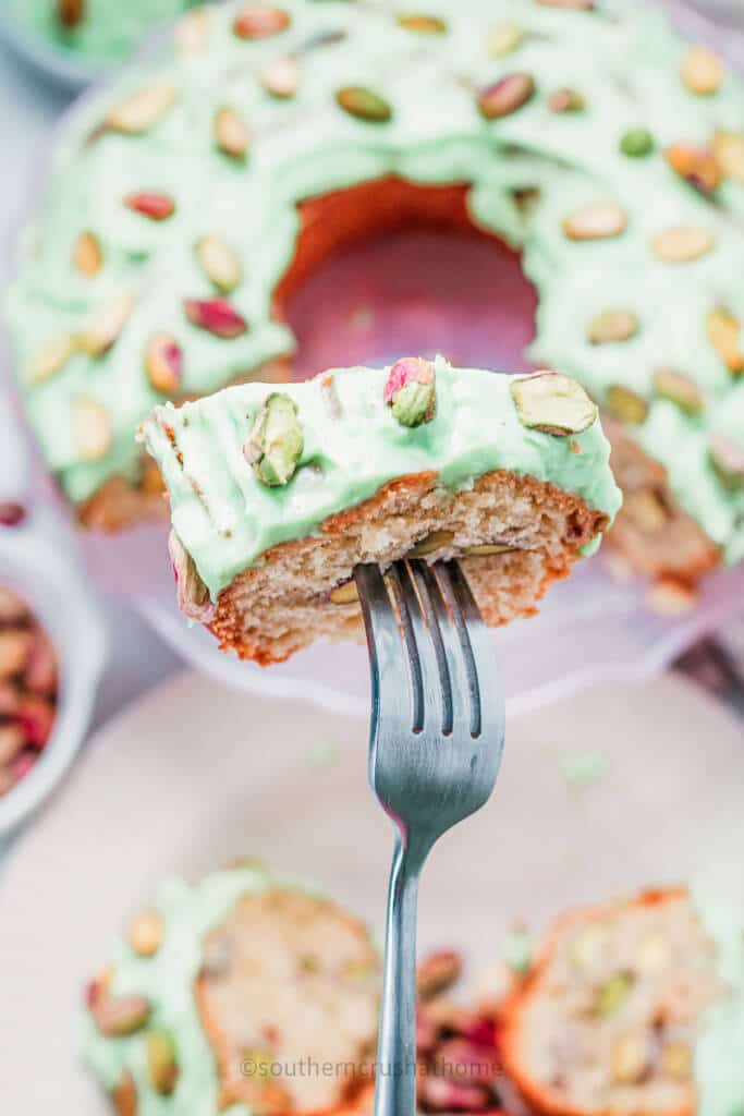 overhead fork view of pistachio cake slice