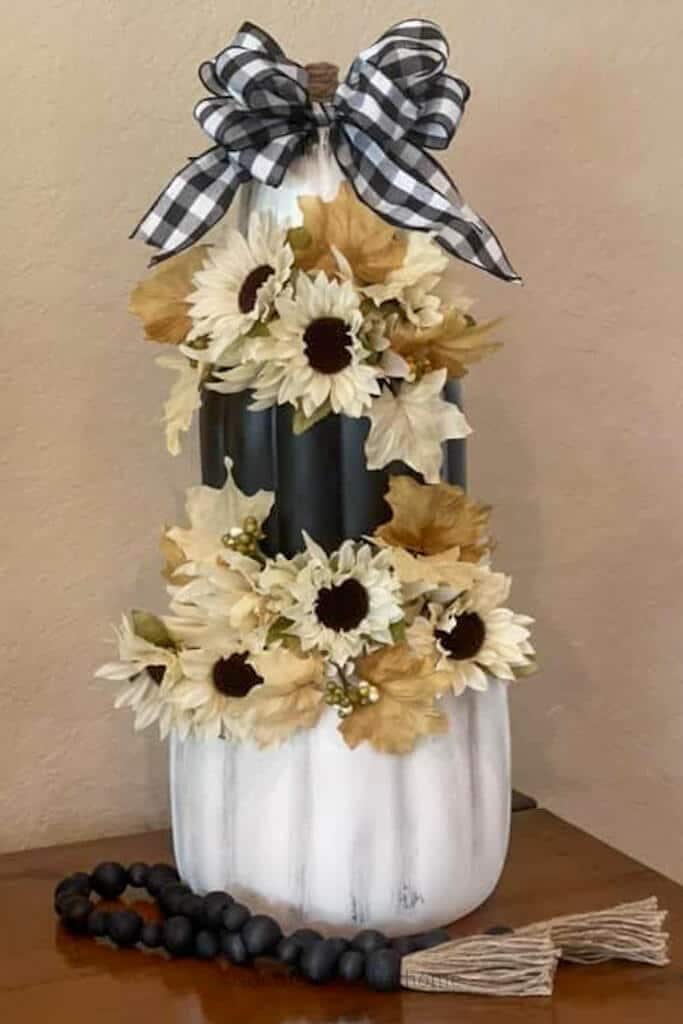 black and white pumpkins with buffalo check bow