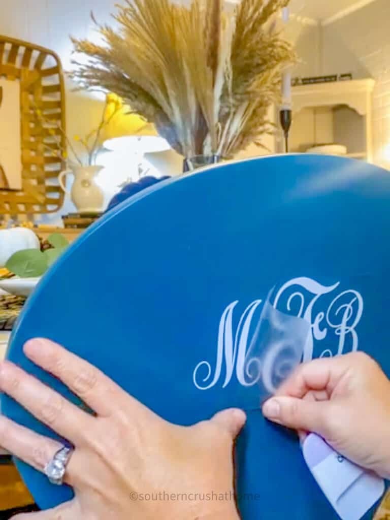applying monogram initials to dining chair