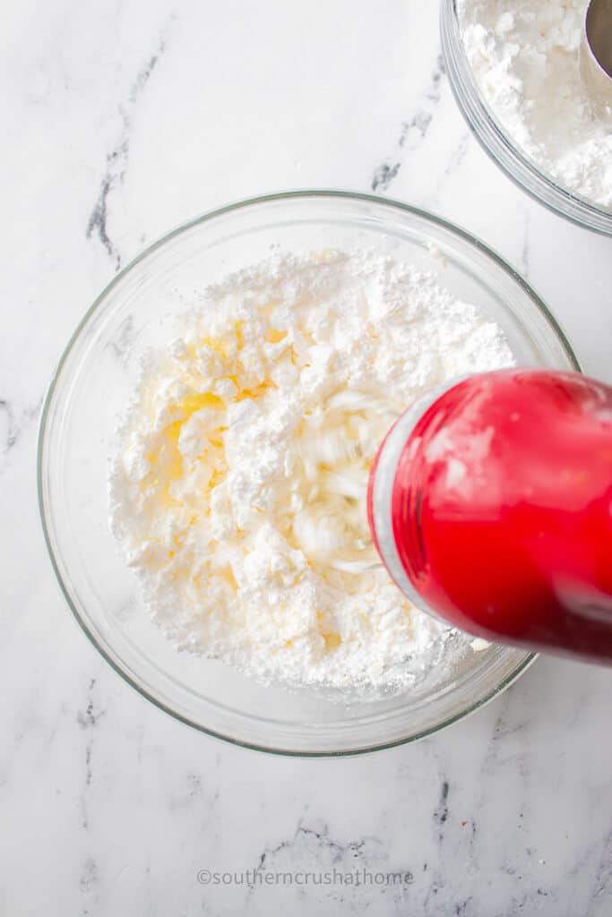 mixing buttermints ingredients with hand mixer