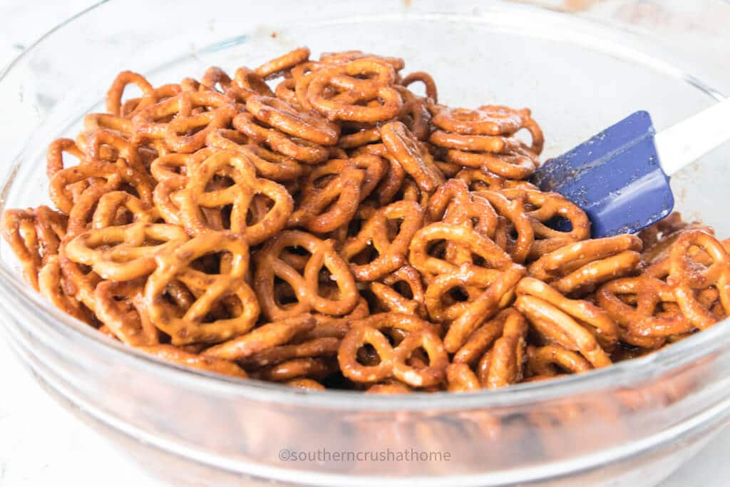 stirring cinnamon sugar pretzels
