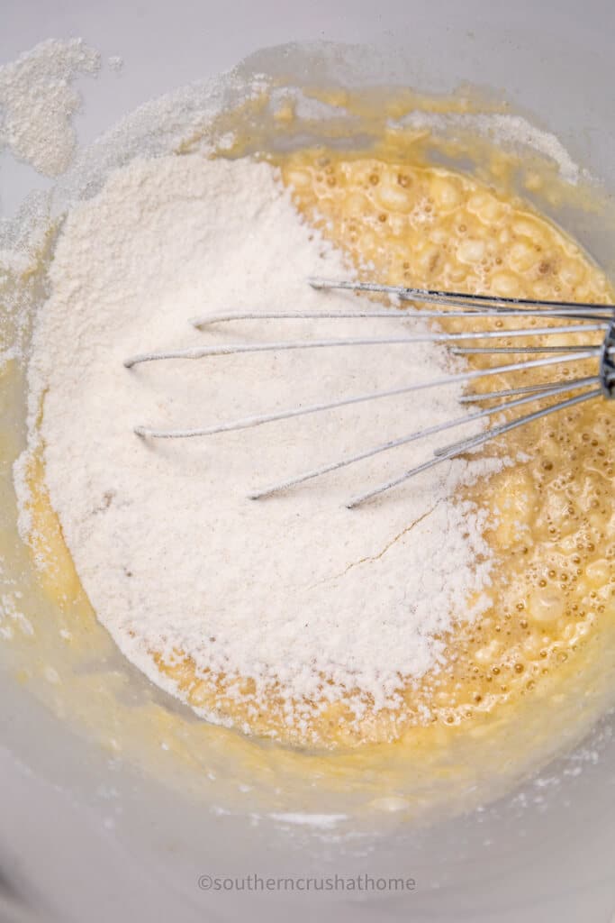 mixing ingredients for pumpkin cinnamon roll casserole