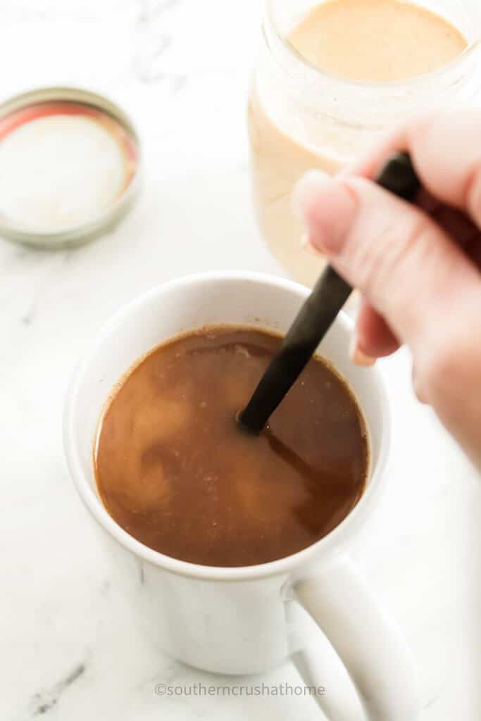 stirring creamer into coffee