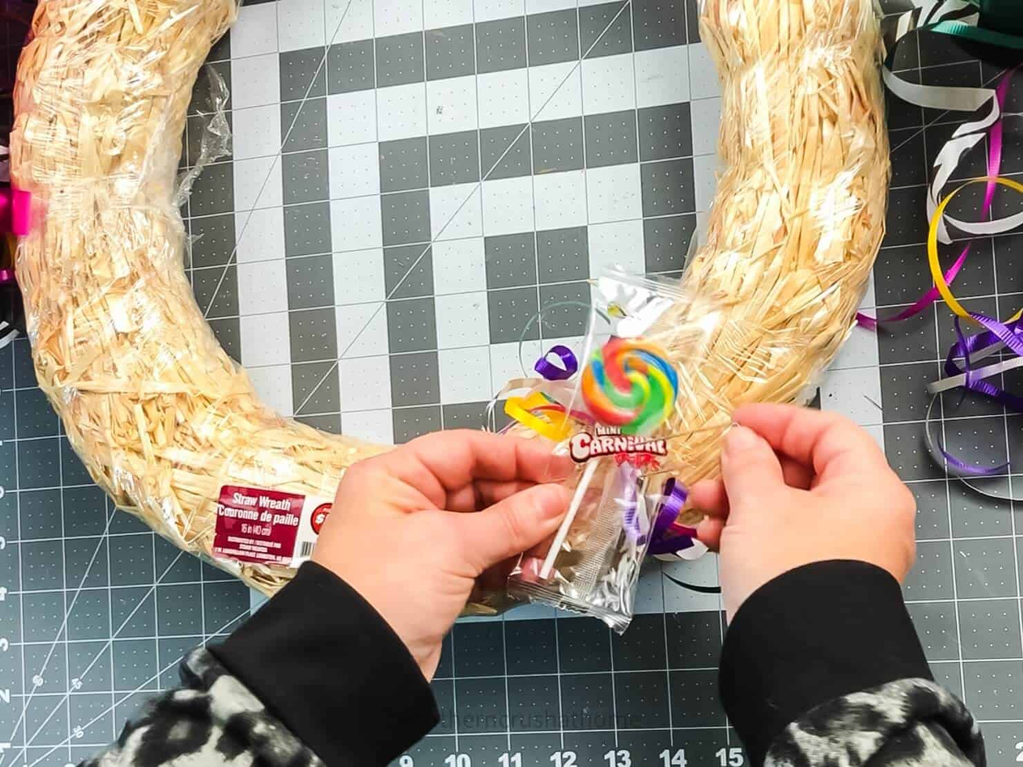 pinning candy on wreath