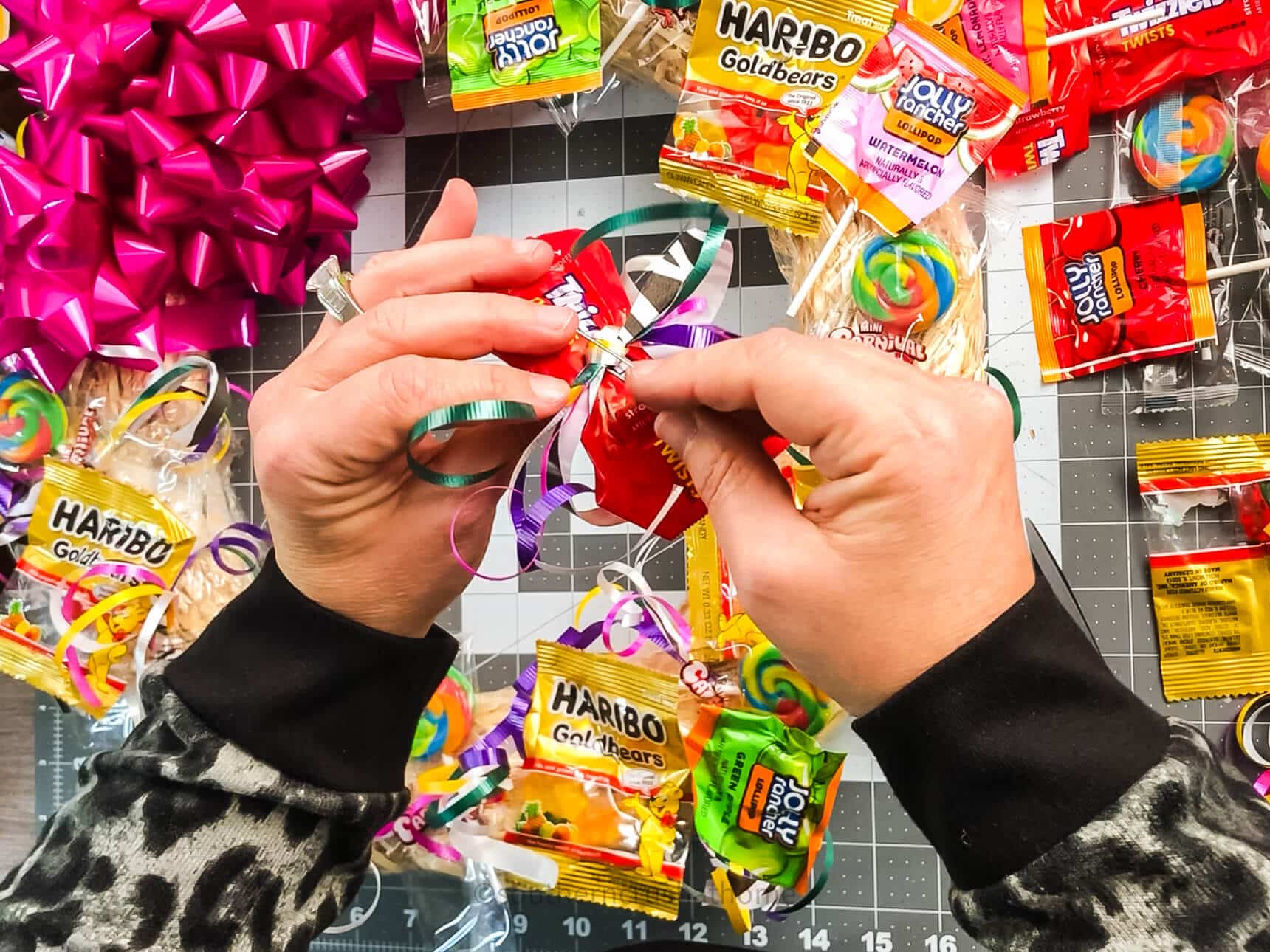 adding floral pin to back of candy