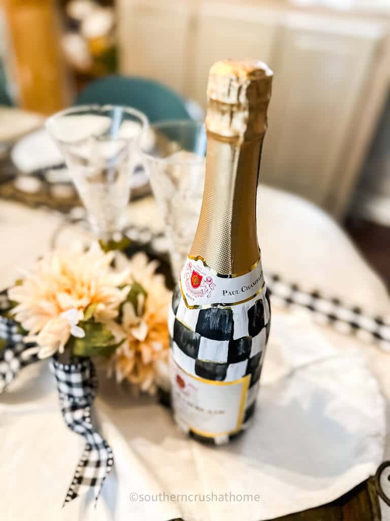 champagne bottle with buffalo check paint