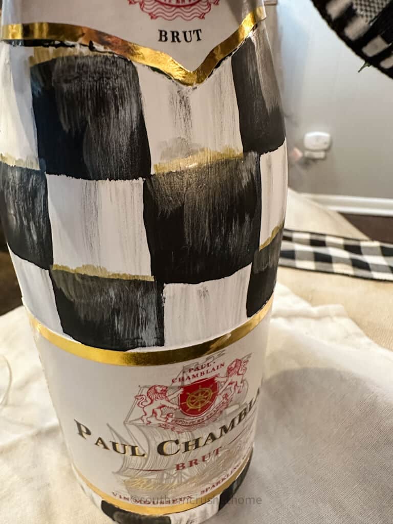 buffalo plaid pattern on champagne bottle up close