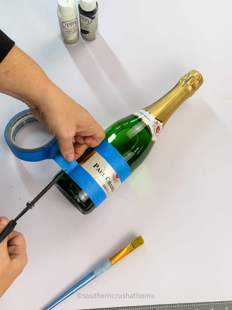 taping off champagne bottle
