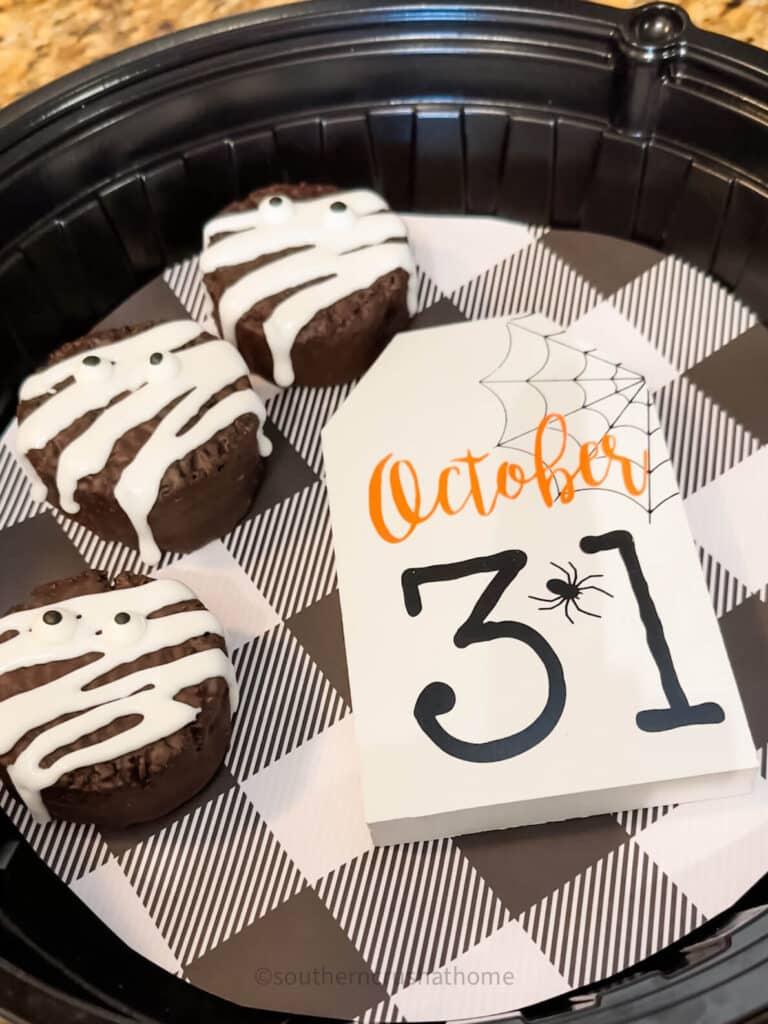 Mummy Ding Dong Cupcakes on platter with sign