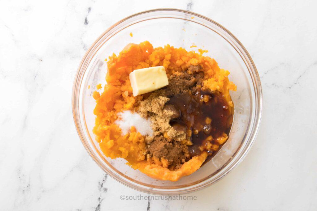 all ingredients for sweet potato casserole in a bowl