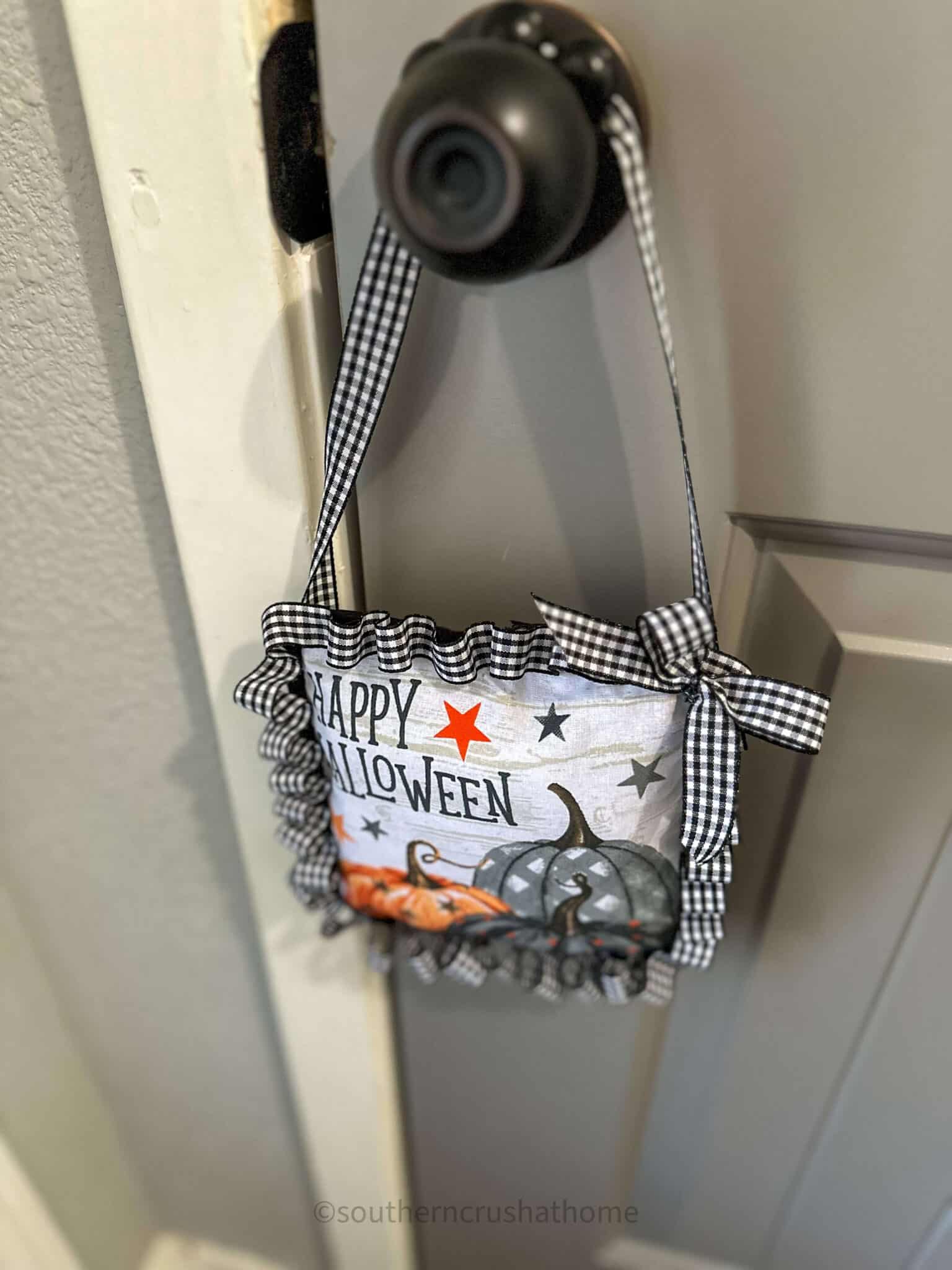 DIY Halloween Potholder Pillow hanging on doorknob