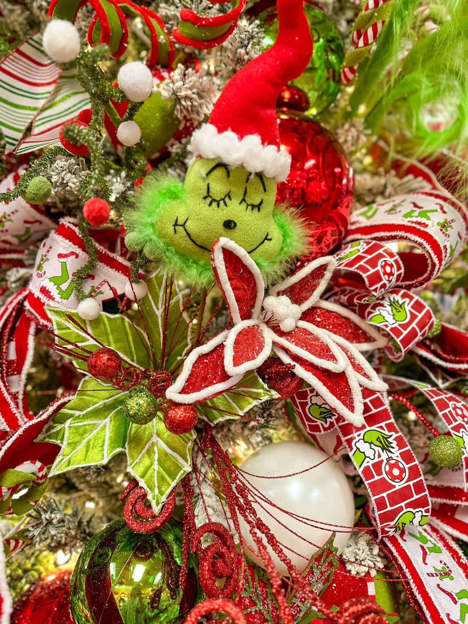 smiling grinch on christmas tree