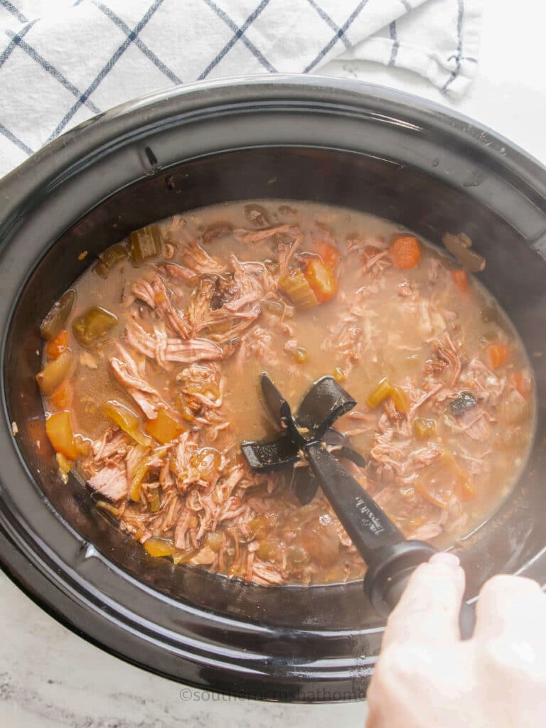 meat tool breaking up pot roast